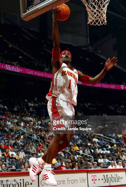 Stephen Jackson of the Atlanta Hawks shoots against the Memphis Grizzlies during the game at Philips Arena on March 29, 2004 in Atlanta, Georgia....