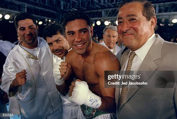 Oscar De La Hoya with his corner after the WBC Welterweight Championship against Patrick Charpentier at the Sun Bowl in El Paso, Texas. De La Hoya...