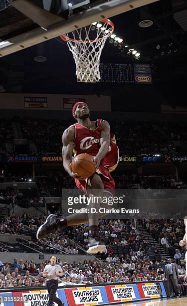 LeBron James of the Cleveland Cavaliers flies in for a dunk against the San Antonio Spurs March 29, 2004 at the SBC Center in San Antonio, Texas....