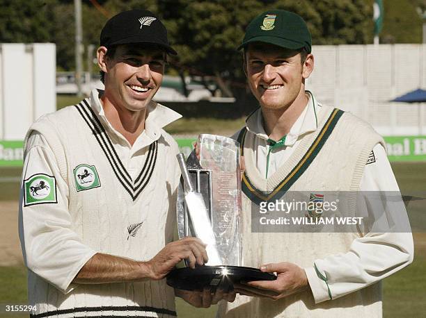 New zealand captain Stephen Fleming and South African captain Graeme Smith hold the shared trophy aloft after South Africa defeated New Zealand on...