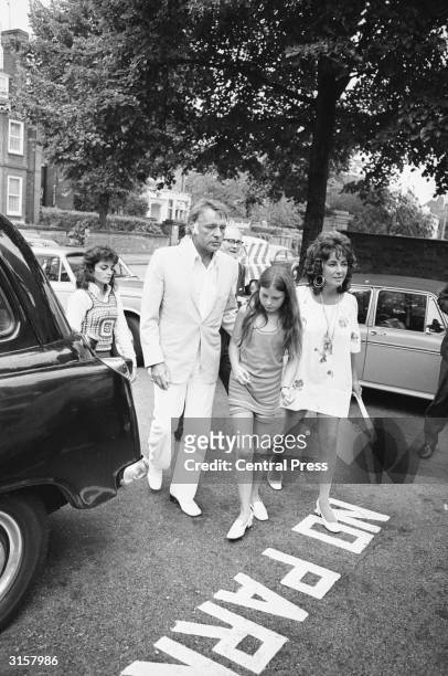 Husband and wife Richard Burton and Elizabeth Taylor, arrive at a north London clinic to visit Taylor's first grandchild, newly born to her son...