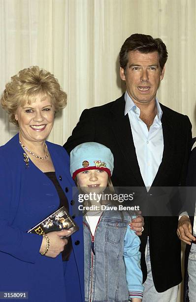 Evelyn Doyle, Sophie Vavasseur and Pierce Brosnan attend the photo call for film "Evelyn" at Claridges Hotel on March 17, 2003 in London.