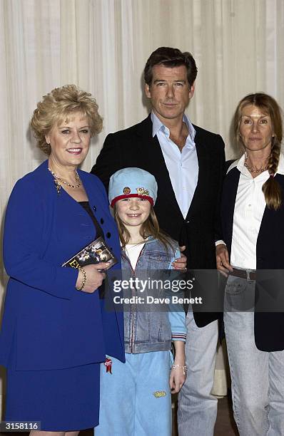 Evelyn Doyle, Sophie Vavasseur, Pierce Brosnan and producer Beau St Clair attend the photo call for film "Evelyn" at Claridges Hotel on March 17,...