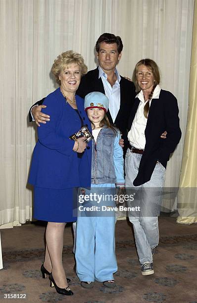 Evelyn Doyle, Sophie Vavasseur, Pierce Brosnan and producer Beau St Clair attend the photo call for film "Evelyn" at Claridges Hotel on March 17,...