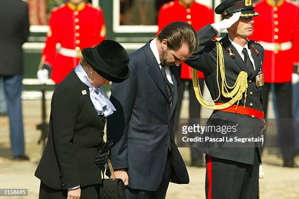 Prince Nikolaos and Queen Anne-Marie of Greece attend the funeral of the Dutch Queen Mother, Princess Juliana, at Nieuwe Kerk on March 30, 2004 in...