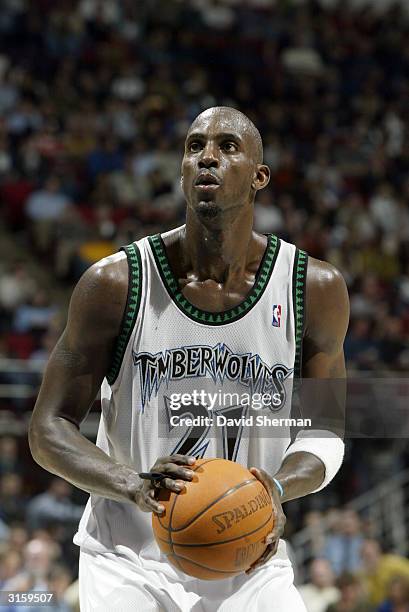 Kevin Garnett of the Minnesota Timberwolves shoots a free throw during the game against the San Antonio Spurs at the Target Center on March 23, 2004...