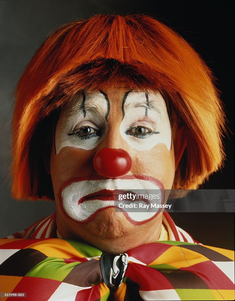 Portrait of clown looking sad, close-up of head