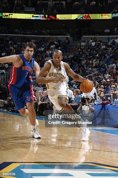 Jamaal Magloire of the New Orleans Hornets drives to the basket during the game against the Detroit Pistons at New Orleans Arena on March 23, 2004 in...