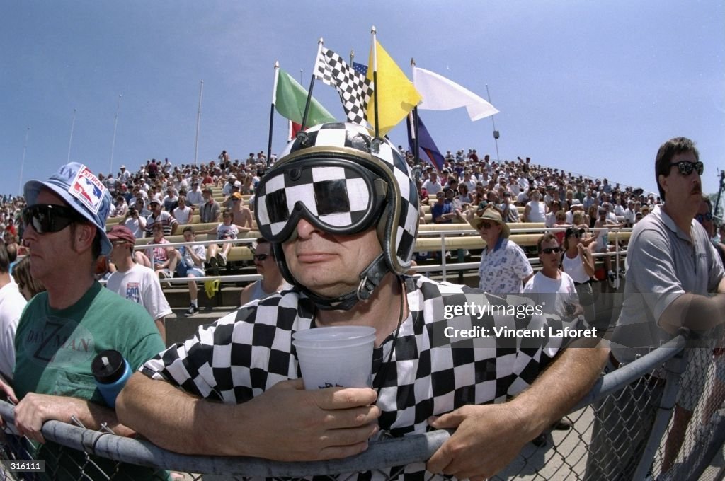 Hottest Racing Fans A race fan in checkered garb watches closely during the 82nd Indy 500 ...