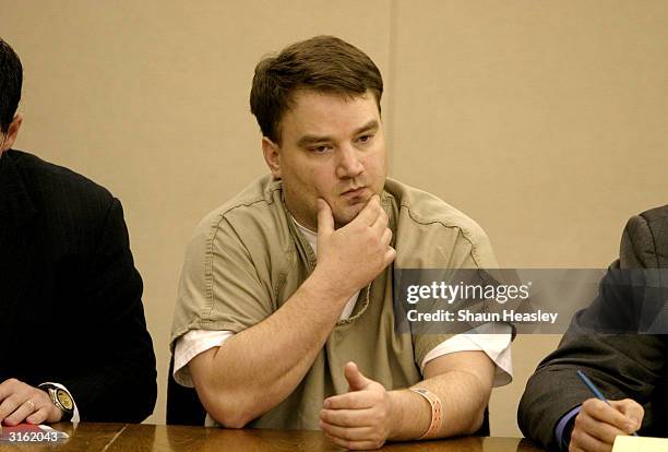 Ohio sniper suspect Charles McCoy Jr. Sits with members of his defense team during a preliminary hearing before Judge Michael T. Brandt at the...