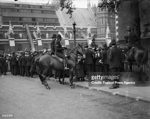 Mounted police keeping the crowd back at the wedding of Lady Diana Manners.