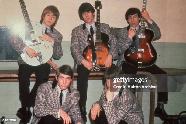 British rock group the Rolling Stones, comprising drummer Charlie Watts, frontman Mick Jagger, guitarists Keith Richards and Brian Jones and bassist...