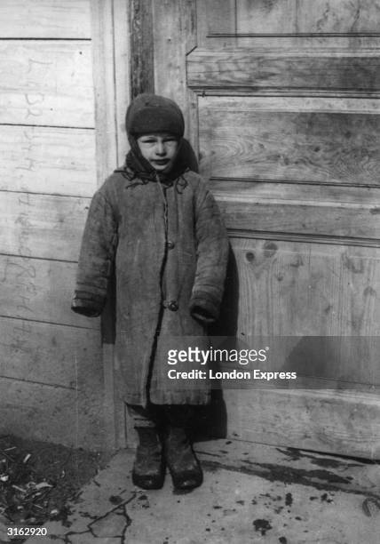 Russian boy, whose parents died of starvation, near Kiev during the famine.