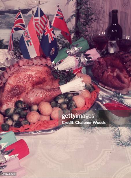Traditional roast turkey dinner served with cranberry sauce, Brussel sprouts and croquette potatoes.