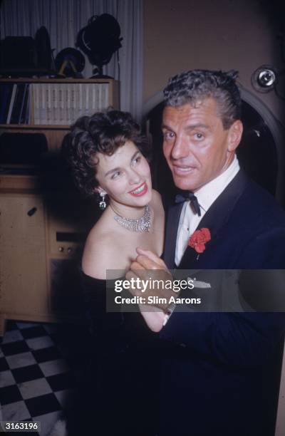 Greg Bautzer and film star Linda Christian at a party given by James Mason in Beverly Hills.