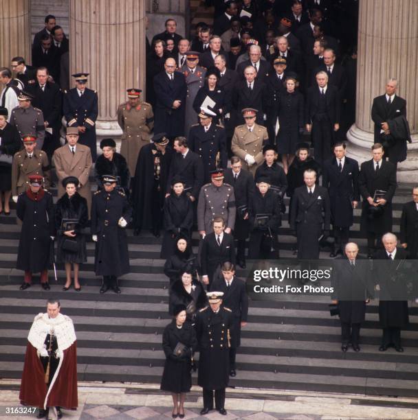 Mourners at the funeral of Sir Winston Churchill on the steps of St Paul's. Queen Elizabeth II and Prince Philip are in the front, behind them the...