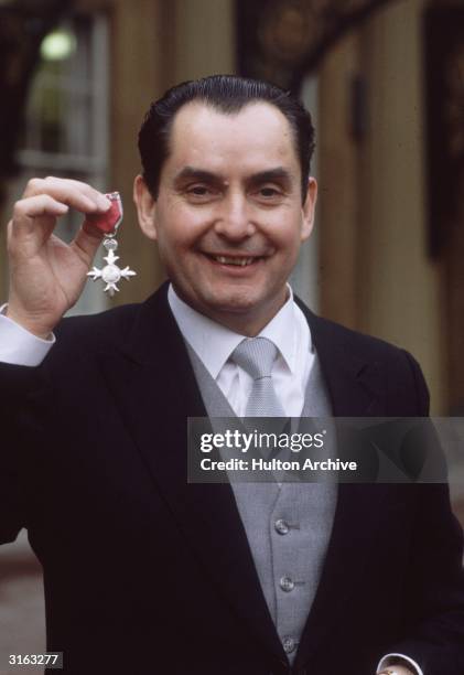 British snooker player Ray Reardon receives an MBE at Buckingham Palace, London.