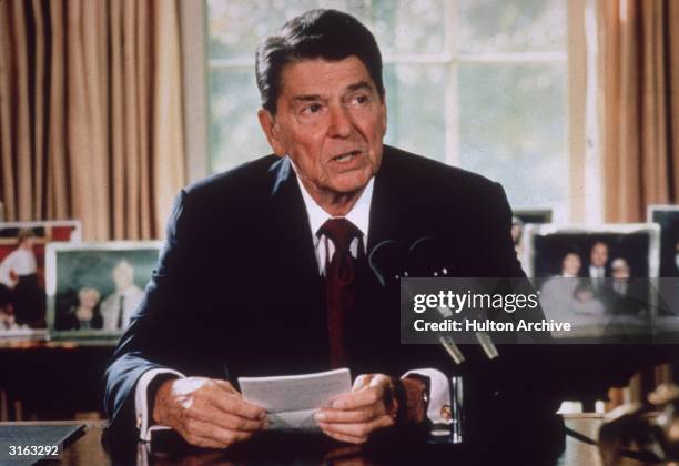 American president Ronald Reagan makes an announcement from his desk at the White House, Washington DC.