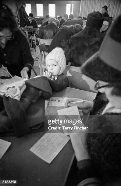 Inhabitants of West Berlin apply for Christmas permits to East Berlin.