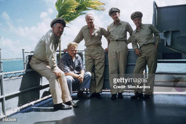 To r; Ward Bond as CPO Dawdy; James Cagney as the Captain; William Powell as Doc; Henry Fonda as Lt Doug Roberts and Jack Lemmon as Ensign Frank...