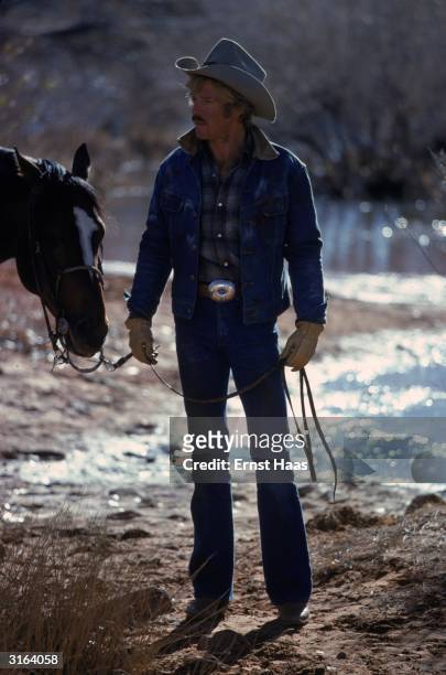 Rugged actor Robert Redford in Utah to film the western romance 'The Electric Horseman', directed by Sydney Pollack.