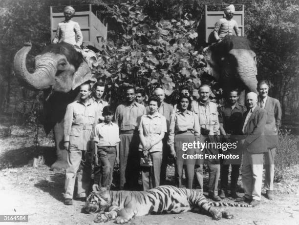 From left to right; Prince Philip with Prince Jagat-Singh , the Maharajah of Jaipur, Queen Elizabeth II and the Maharanee of Jaipur. The tiger which...