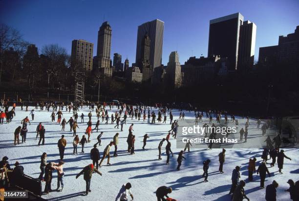 People skating in New York's Central Park in winter.