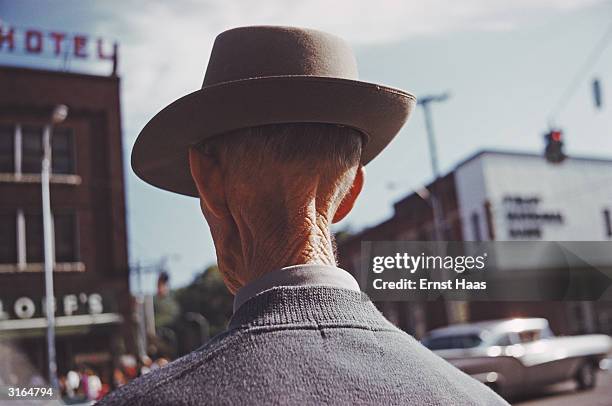 The wrinkled nape of an elderly man's neck.