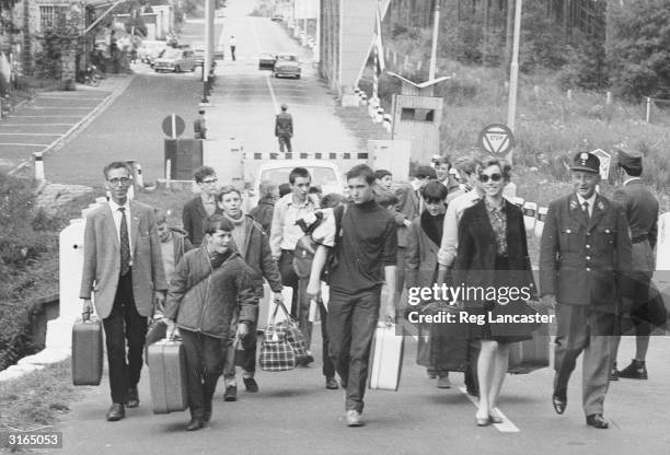 Refugees at the border between Czechoslovakia and Germany after the Soviet invasion following the 'Prague Spring' in which the Czech communists tried...