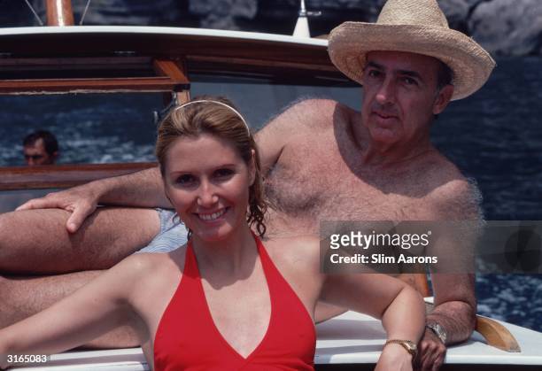 Prince Sforza Ruspoli and Princess Pia Ruspoli sunbathing on the deck of a motor boat at Capri, Italy.