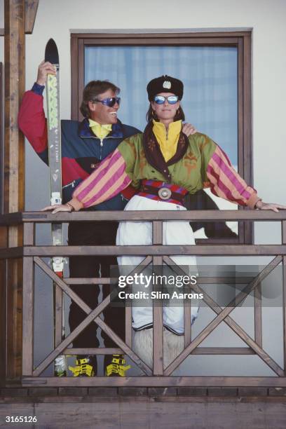 Alpine ski champion Max Rieger on the balcony of a villa in Gudari, in the Caucasus mountains,Georgia. With him is Meg O'Neil dressed in ski suit...