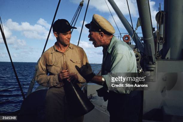 Jack Lemmon and Ward Bond on board the supply ship 'Reluctant' in a scene from the naval comedy 'Mister Roberts'.