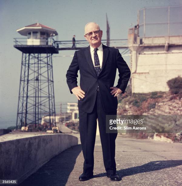 Paul J Madigan, warden of Alcatraz from 1955 to 1961 stands on a path near the prison, San Francisco, California.