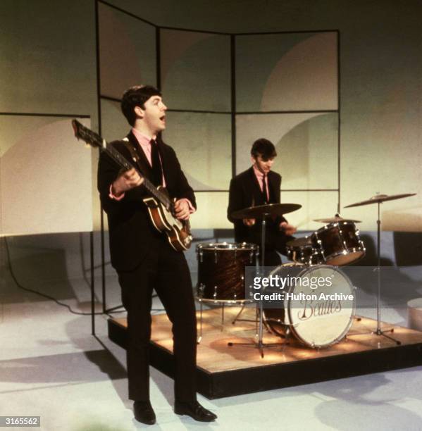 Paul McCartney and Ringo Starr of The Beatles performing during an early television performance on 'Thank Your Lucky Stars' on February 17th 1963.