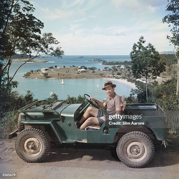 Laurance Rockefeller, son of the oil magnate and philanthropist J D Rockefeller, sitting in a jeep, circa 1957.