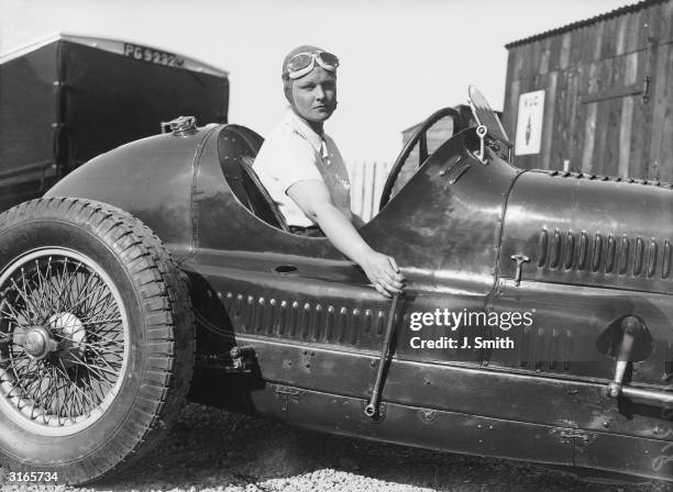 Miss E Ellison, the only female competitor in the Junior Car Club 200 miles race, in her Maserati racing car.