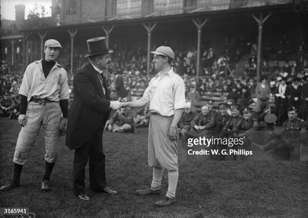 London Lord Mayor and founder of Castrol Charles Wakefield greeting the captains of the Canadian and London American baseball teams before their...