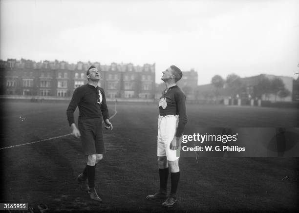 The captains of the Australian and the London Australian Rugby teams spin a coin for the kickoff at the Queen's Club in Kensington, London.
