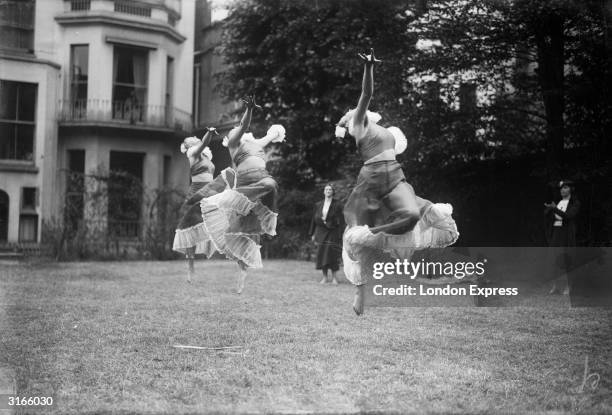 Three costumed young ladies leap, dance and prance for their audience's delight.