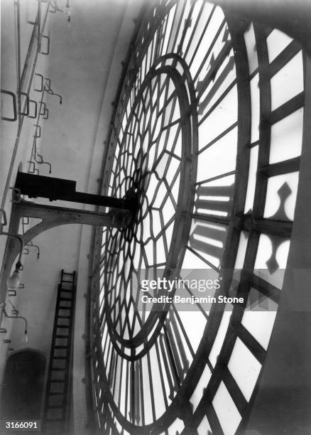 Inside St Stephenfs Tower, Westminster Palace, showing the 23 ft diameter clock-face of Big Ben, named after the bell weighing 13.5 tons.