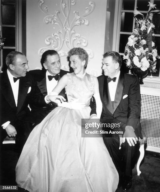 From left to right, composer Richard Rodgers , producer Leland Hayward , actress Mary Martin and songwriter Oscar Hammerstein attend a party to...