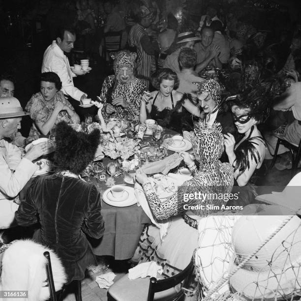 Guests at a fancy dress party held at the Romanoff Restaurant in Hollywood, Los Angeles.