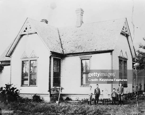 Young Dwight David Eisenhower with his brothers outside the family home in Abilene, Kansas.