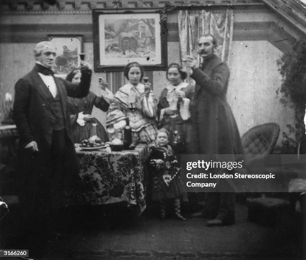 Wearing a kilt and sporran, Charles Sherwood Stratton known as General Tom Thumb and only 40 inches tall, is drinking a toast with friends.