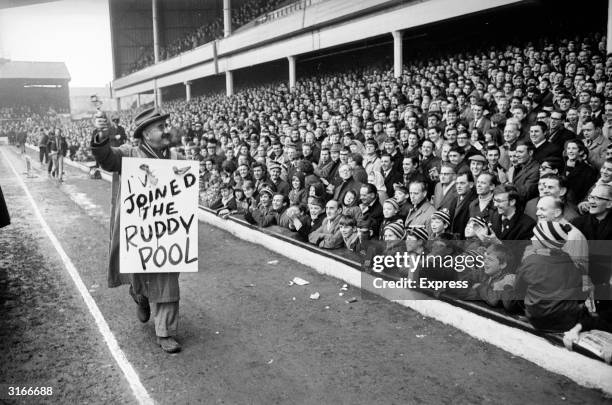 Warren Mitchell, star of the television comedy program 'Till Death Us Do Part' at West Ham United's Football Stadium, Upton Park, in the East-End of...