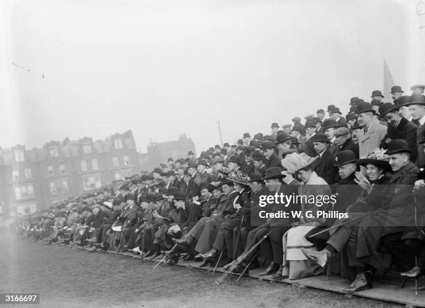 Crowds attend a British Army vs Royal Navy football match.