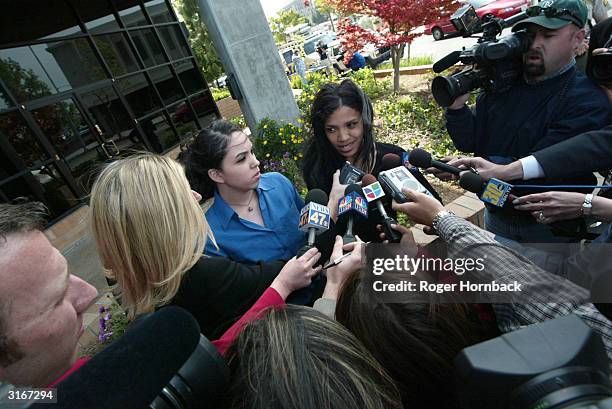 The daughters of accused murderer Marcus Wesson, Rosie Solorio and Kiani Wesson, talk to the media in front of the court house after Wesson's court...