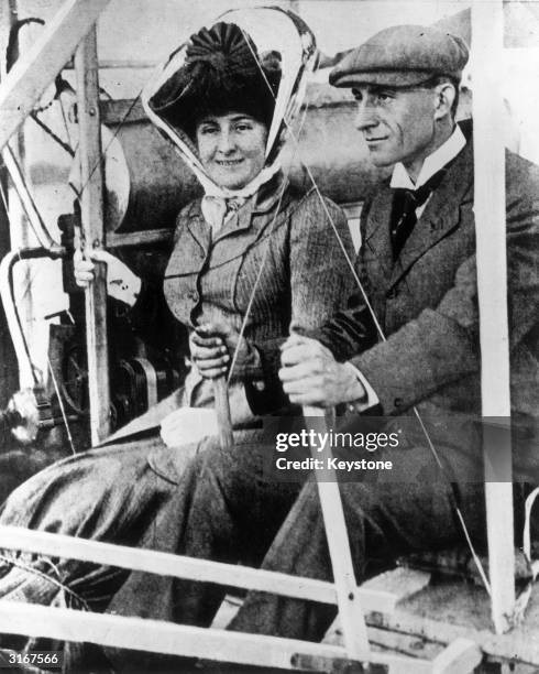 American inventor and aviator Wilbur Wright and his passenger Mrs Hart Berg, who is about to become the first woman to fly.