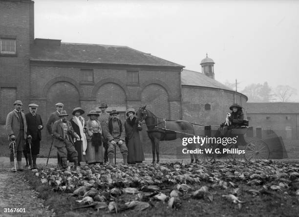 Members of a shooting party with their haul of pheasants after a shoot at Walcot Park, Lyndbury, in north Shropshire.