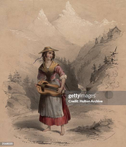 Young girl walks barefoot by a stream in the Swiss Alps, carrying a mountain dulcimer.